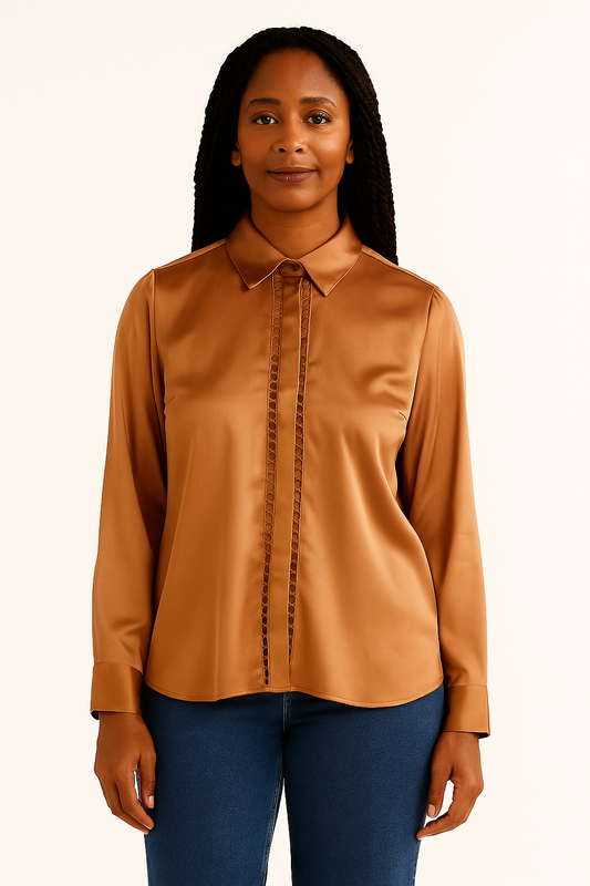 Woman wearing a brown blouse with a plain background