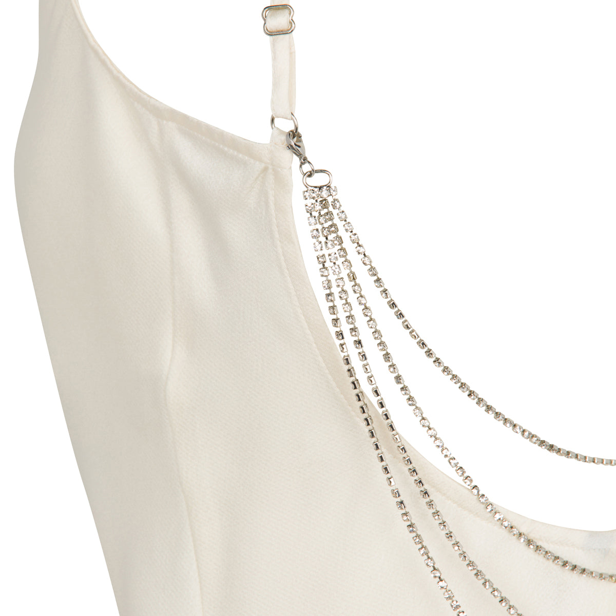 This image features a sleek and elegant satin camisole, known as "Satin Diamonds." The tank top is presented in a soft, creamy white color, highlighting a luxurious sheen, with a diamond chain attached.